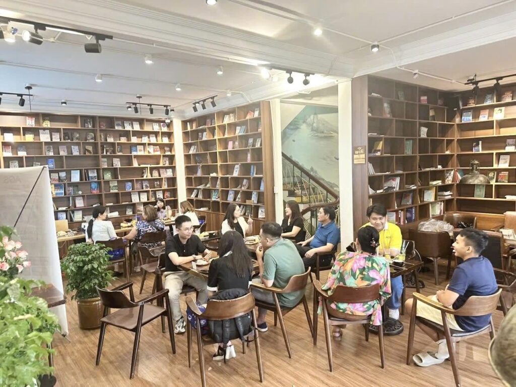 A1 team and guests at a community meetup in a bookshop café